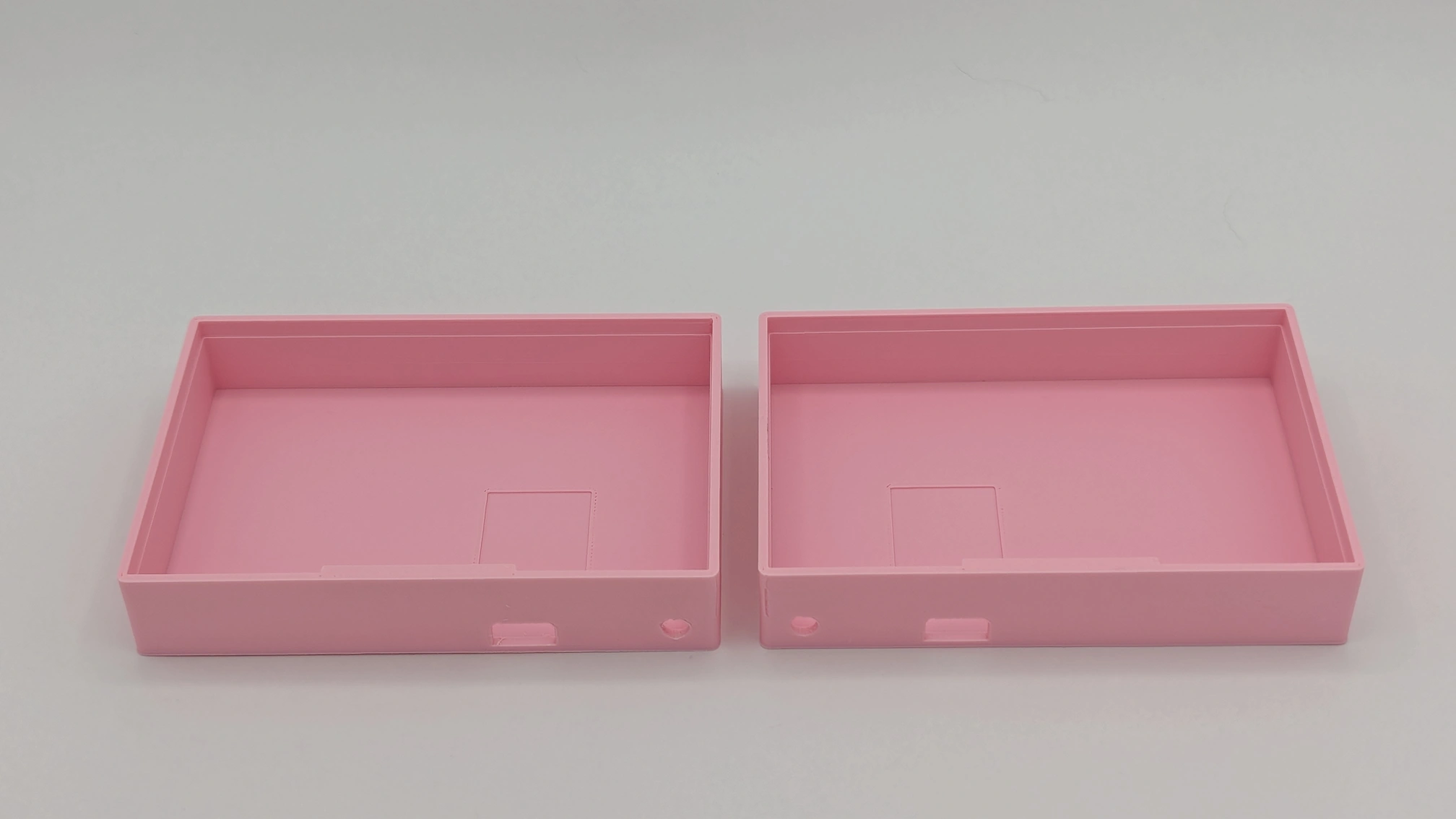 Sleepy Keeb Split case in pink. Back view showing the openings for the trrs jack and the usb port.